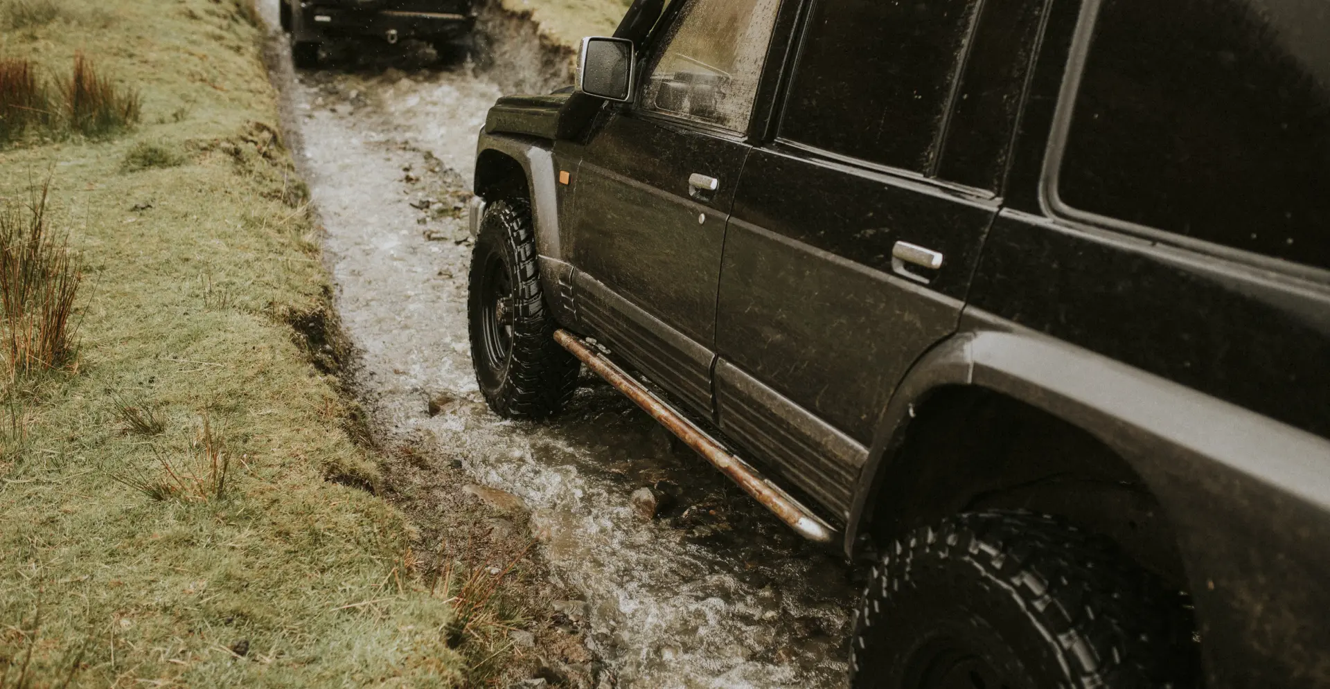 Luxury vehicle in dramatic setting